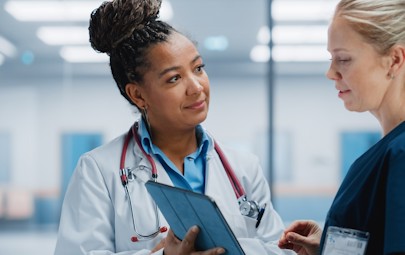 physician consulting with nurse physician consulting with nurse